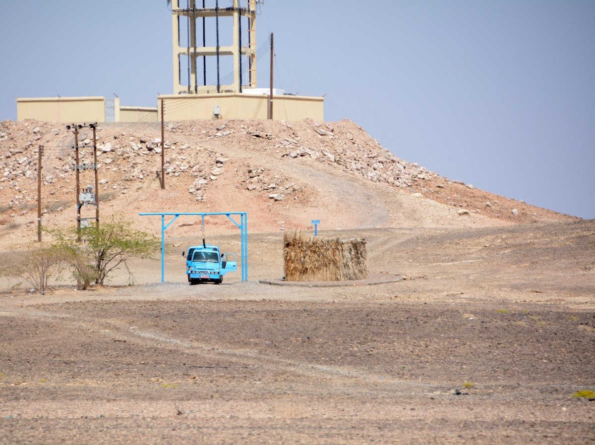 Bright turquoise blue water trucks, filling up at a water storage stop, Unmissable, hence the photograph...